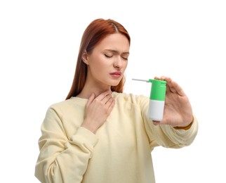 Young woman holding throat spray on white background