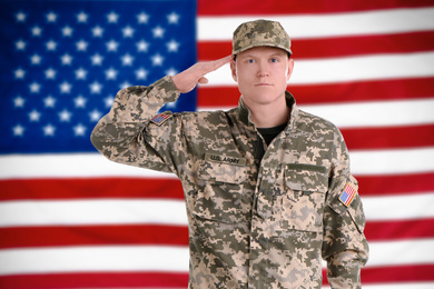 Image of Male soldier and American flag on background. Military service