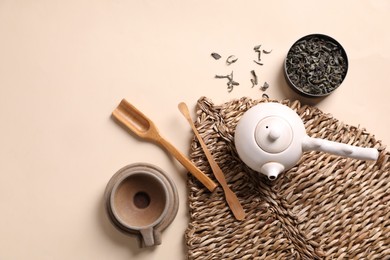 Photo of Beautiful set for traditional tea ceremony on beige background, flat lay