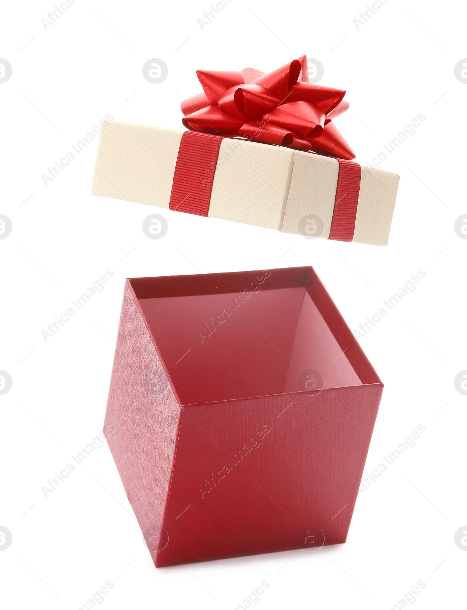 Photo of Open empty gift box with bow on white background