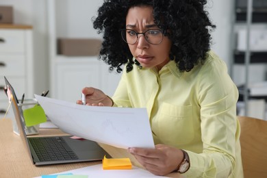 Photo of Deadline concept. Stressed woman looking at document in office