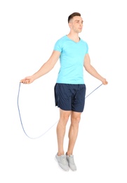 Photo of Full length portrait of young sportive man training with jump rope on white background