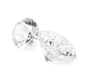 Photo of Two beautiful shiny diamonds isolated on white