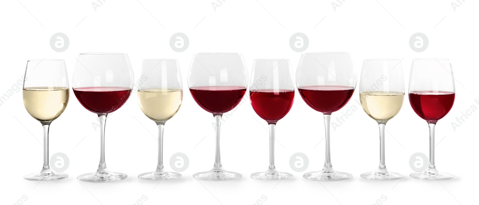 Photo of Glasses with different wine on light background