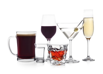 Photo of Many different alcoholic drinks on white background