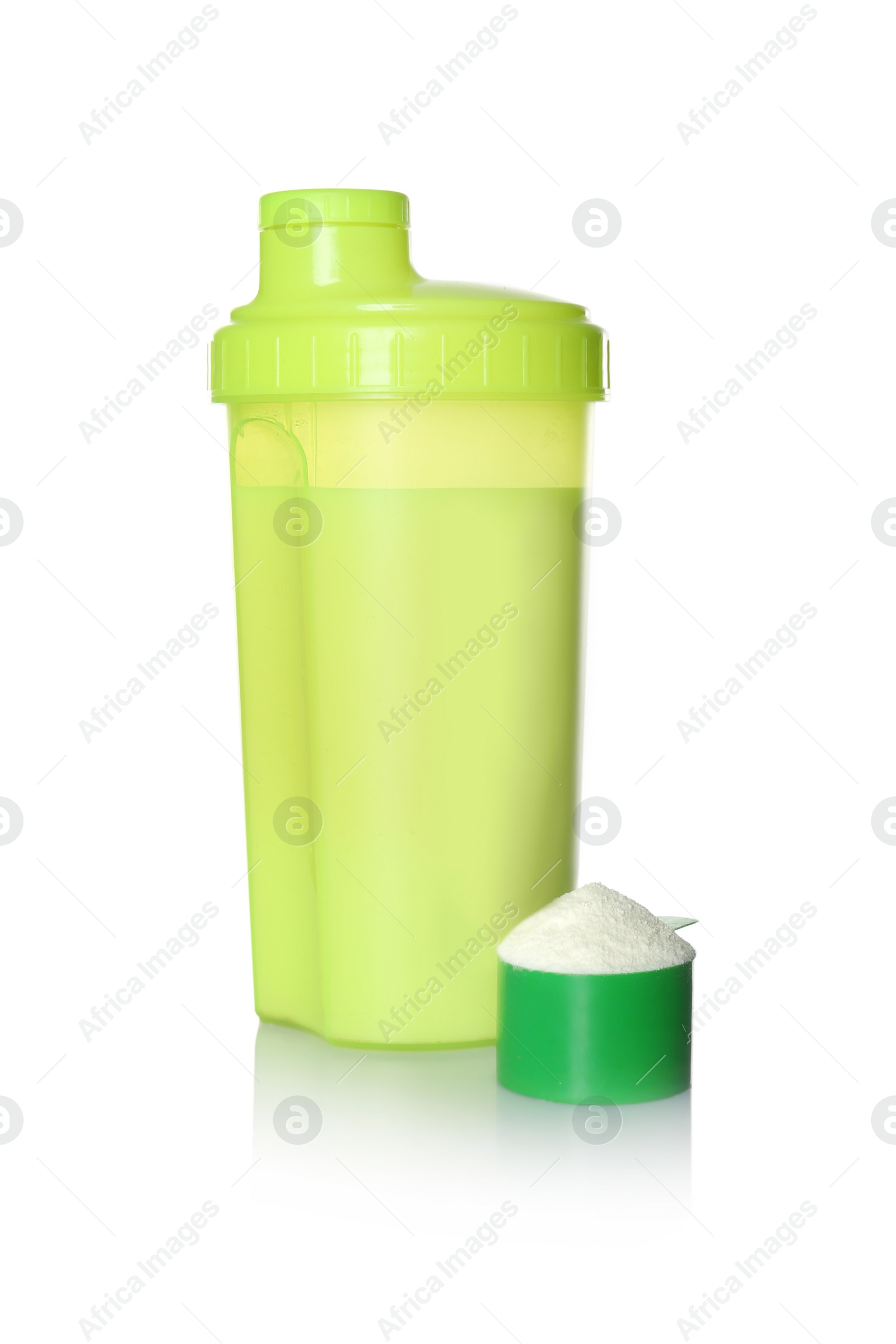 Photo of Protein shake in sport bottle and scoop with powder isolated on white