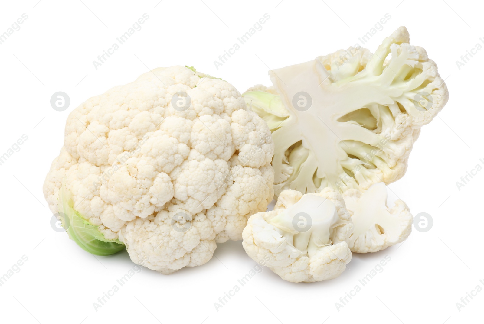 Photo of Cut and whole cauliflowers on white background