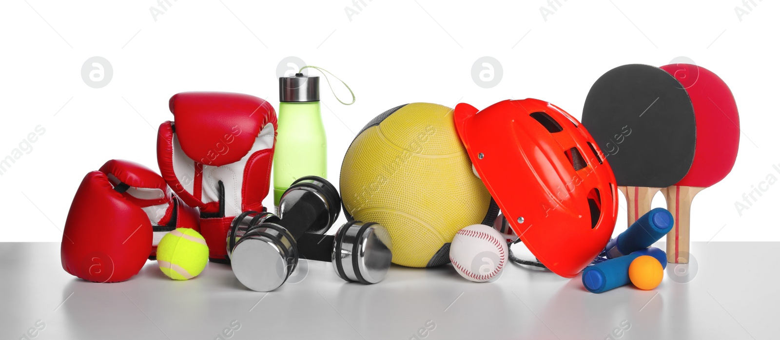 Photo of Set of different sports equipment on white background