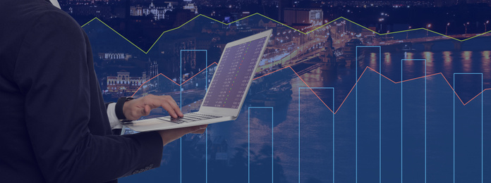 Image of Businessman with laptop and cityscape on background, closeup. Stock exchange trading