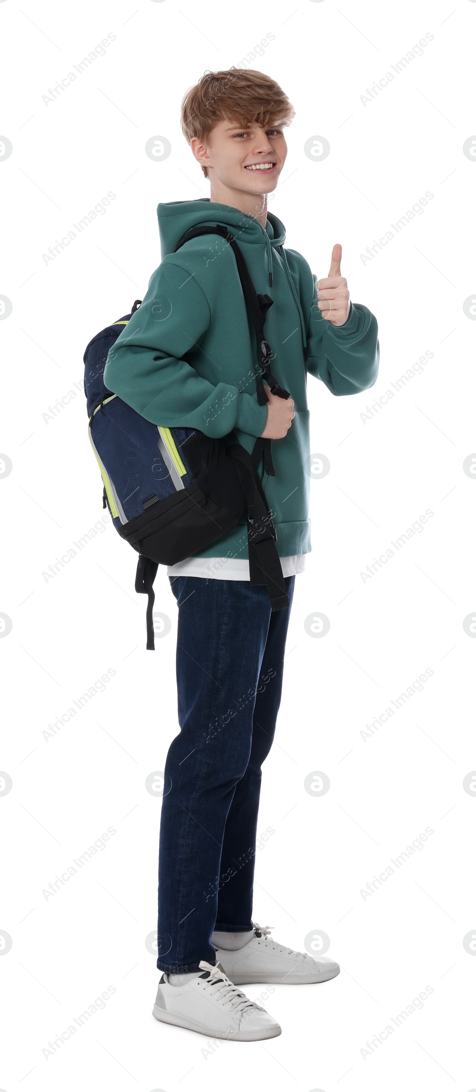 Photo of Teenage boy with backpack showing thumb up on white background