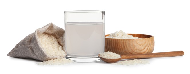 Photo of Homemade natural rice water and grains on white background