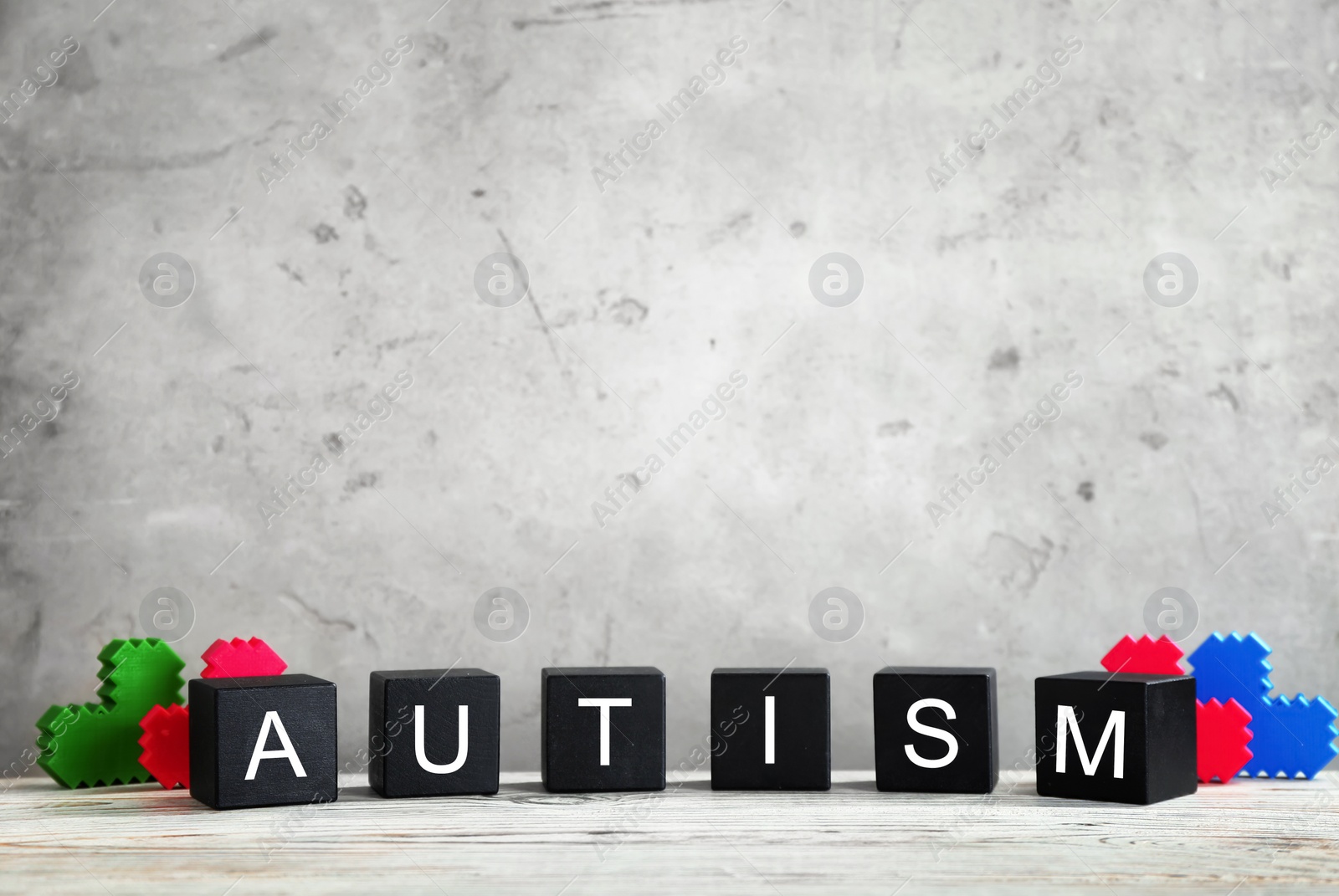 Photo of Cubes with word "Autism" on table