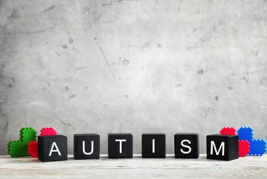 Photo of Cubes with word "Autism" on table