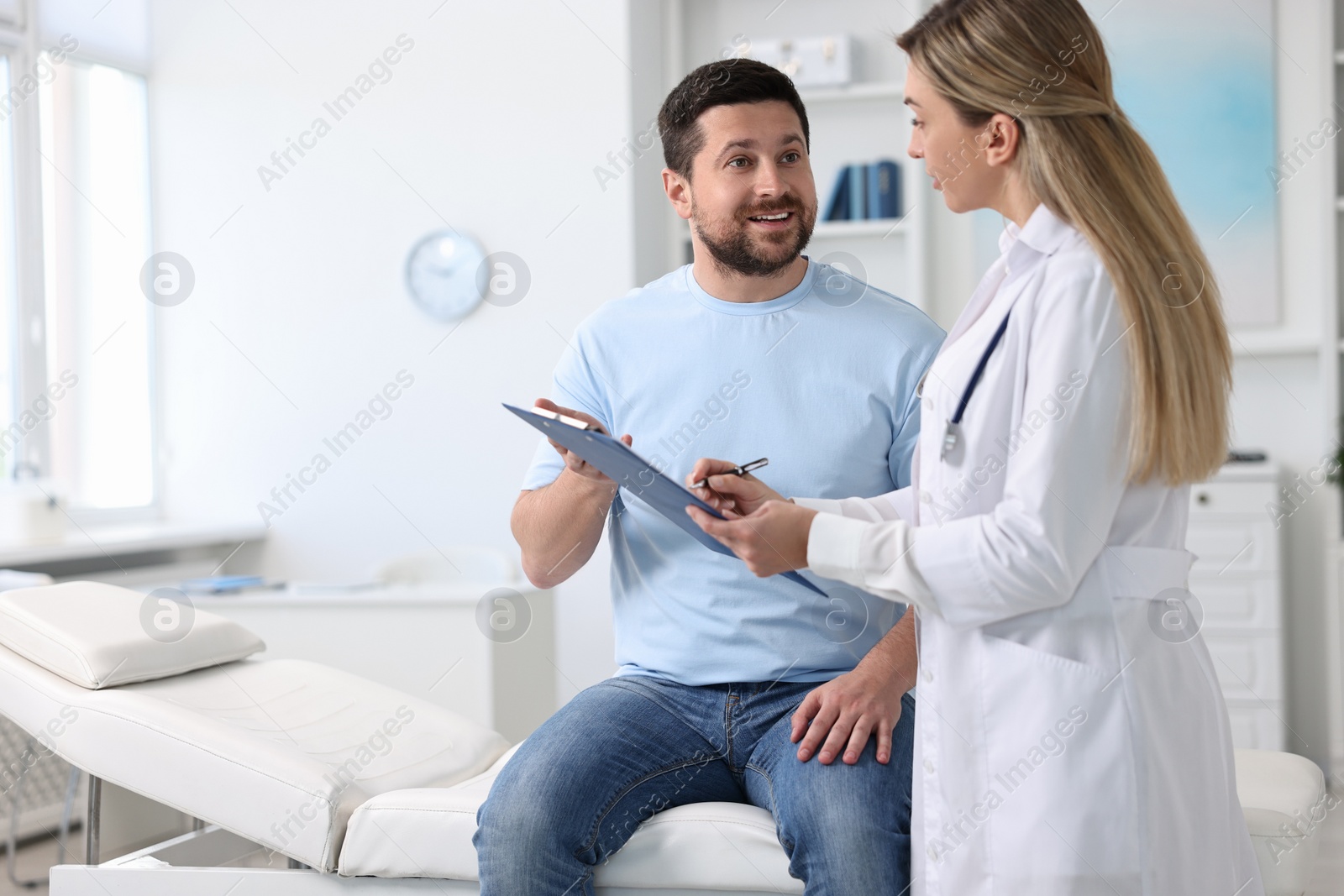 Photo of Professional doctor working with patient in hospital, space for text