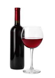 Photo of Bottle and glass of expensive red wine on white background