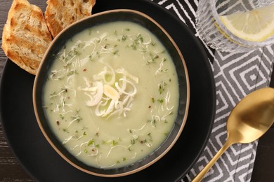 Delicious leek soup served on table, top view