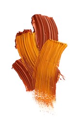 Photo of Brown and orange oil paint strokes on white background, top view