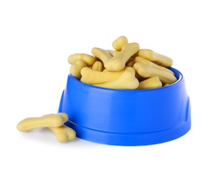 Bone shaped dog cookies and feeding bowl on white background