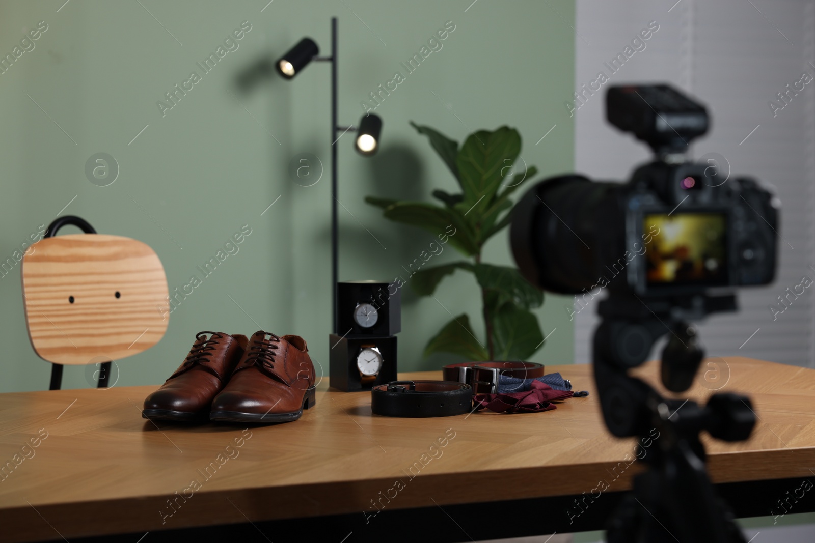 Photo of Beauty blogger's workplace. Men's accessories on table indoors