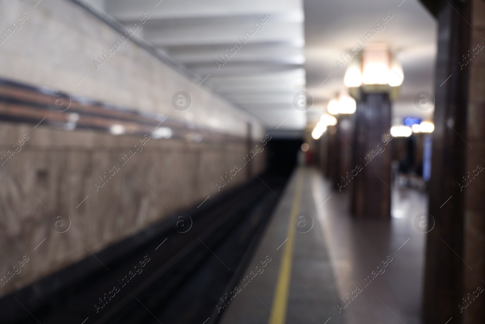 Photo of Blurred view of subway station. Public transport