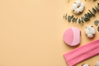 Photo of Flat lay composition with face cleansing brush on beige background. Cosmetic accessory