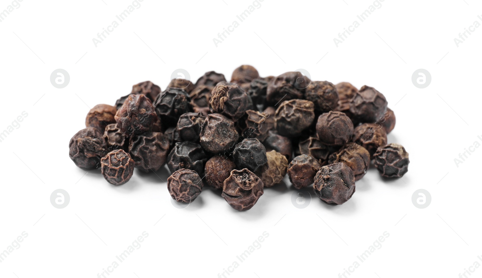 Photo of Aromatic spice. Many black dry peppercorns isolated on white