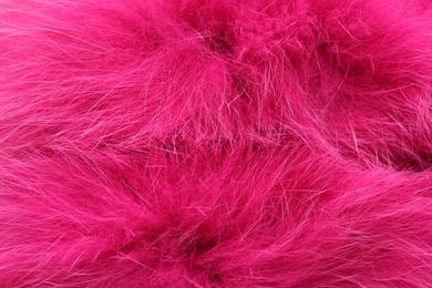 Photo of Texture of bright pink faux fur as background, top view