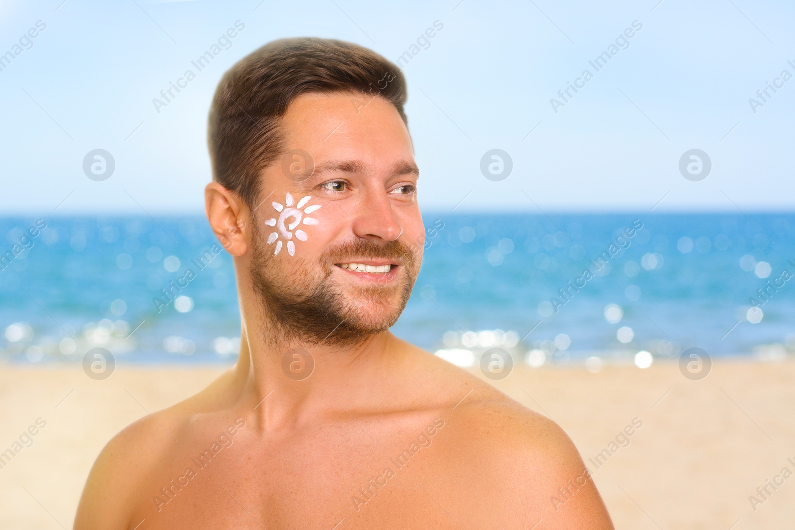 Image of Sun protection. Man with sunblock on his face near sea