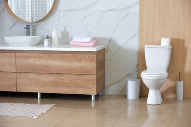 Photo of Interior of modern bathroom with toilet bowl