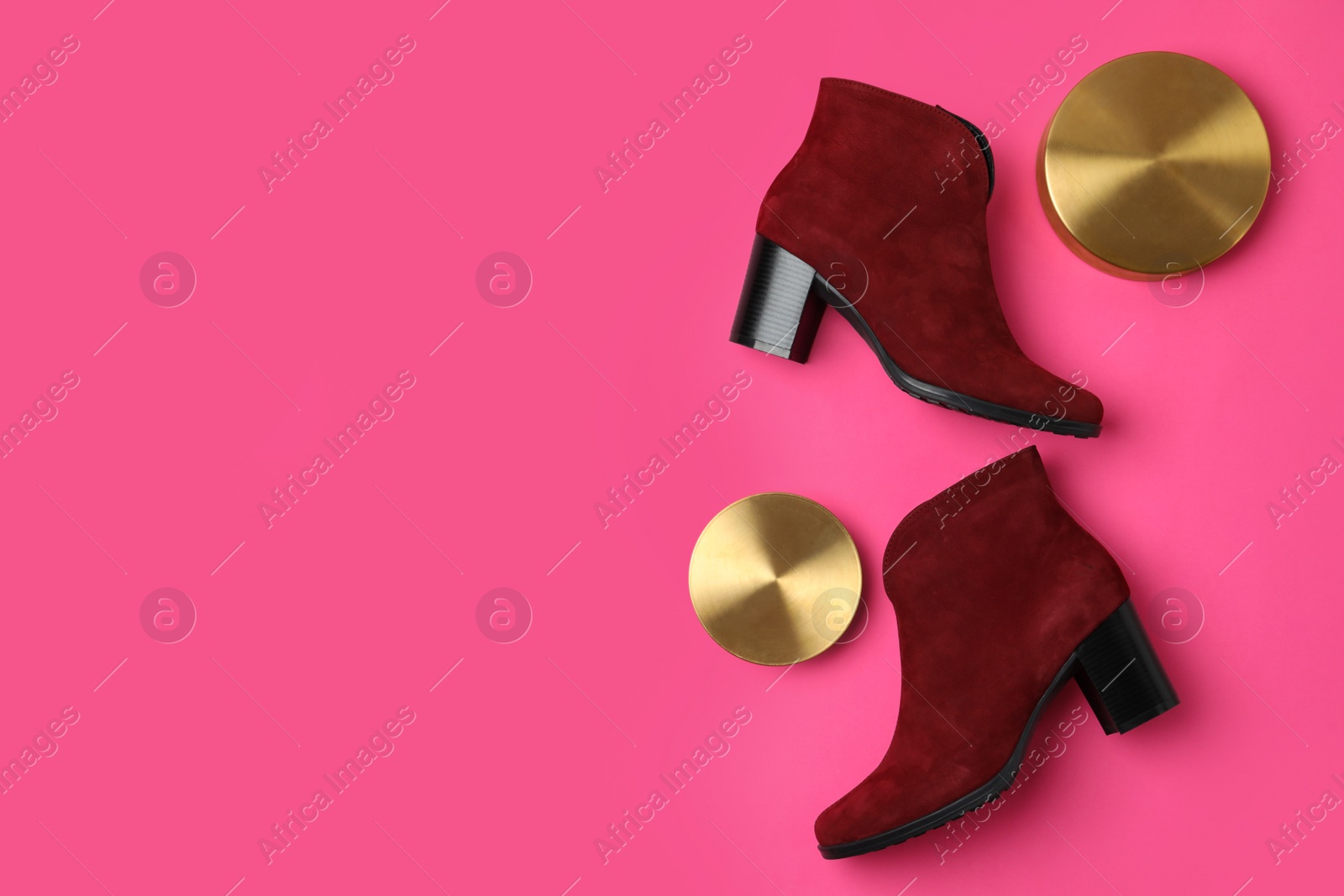 Photo of Stylish red female boots and decor on pink background, flat lay. Space for text