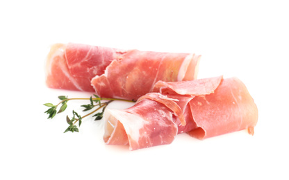 Photo of Slices of tasty prosciutto on white background