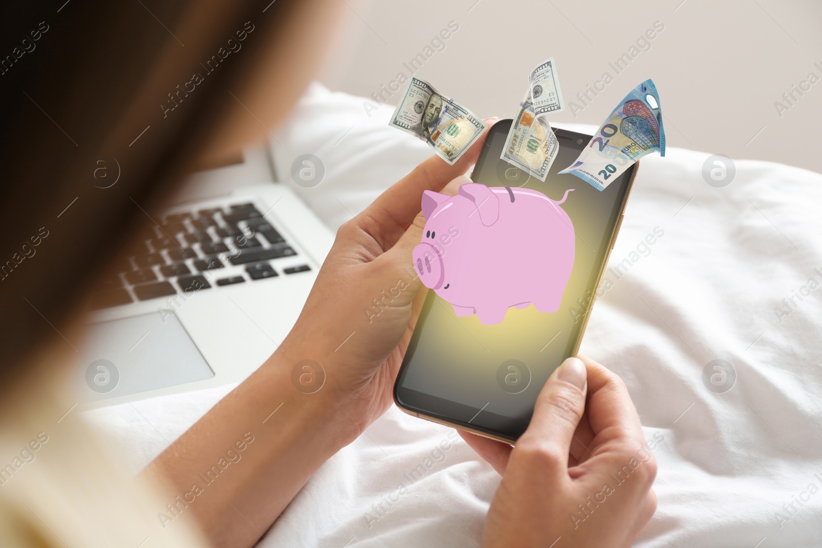 Image of Woman using online bank application on her smartphone at home