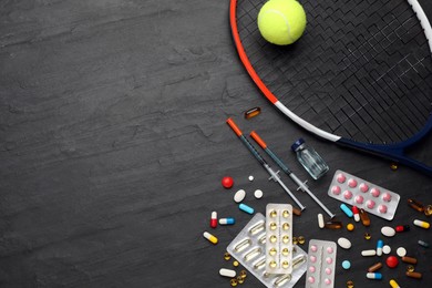 Tennis racket, ball and drugs on black table, flat lay with space for text. Doping concept