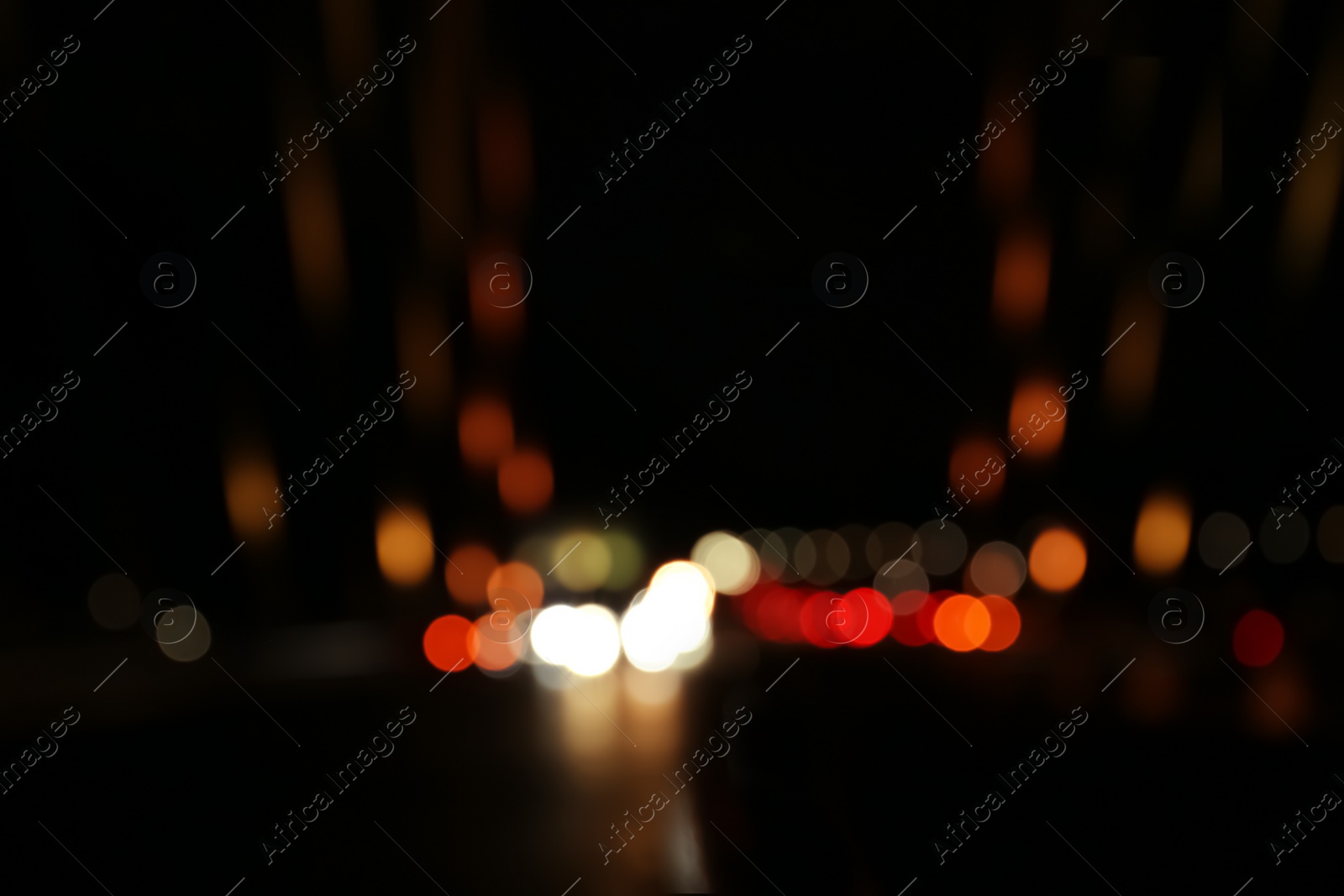 Photo of Blurred view of city lights at night. Bokeh effect