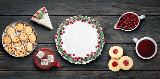 Image of Flat lay composition with different delicious pies on black wooden table. Banner design