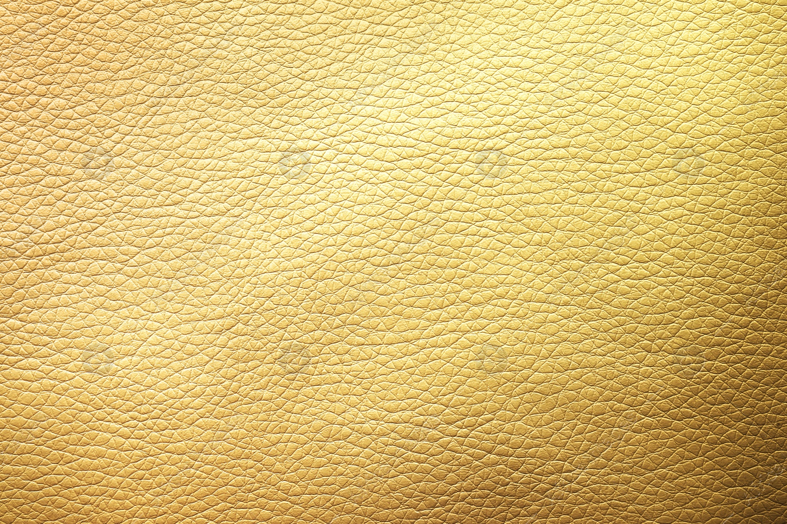 Image of Golden textured surface as background, closeup view