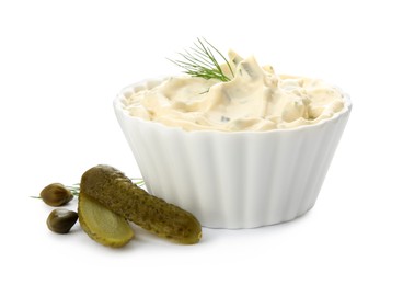 Tartar sauce and ingredients on white background