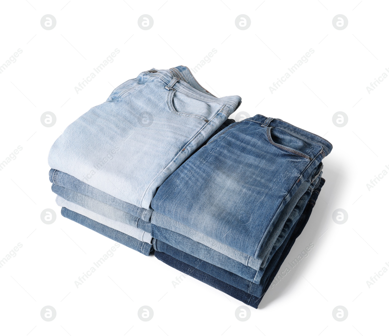 Image of Stacks of different folded jeans isolated on white