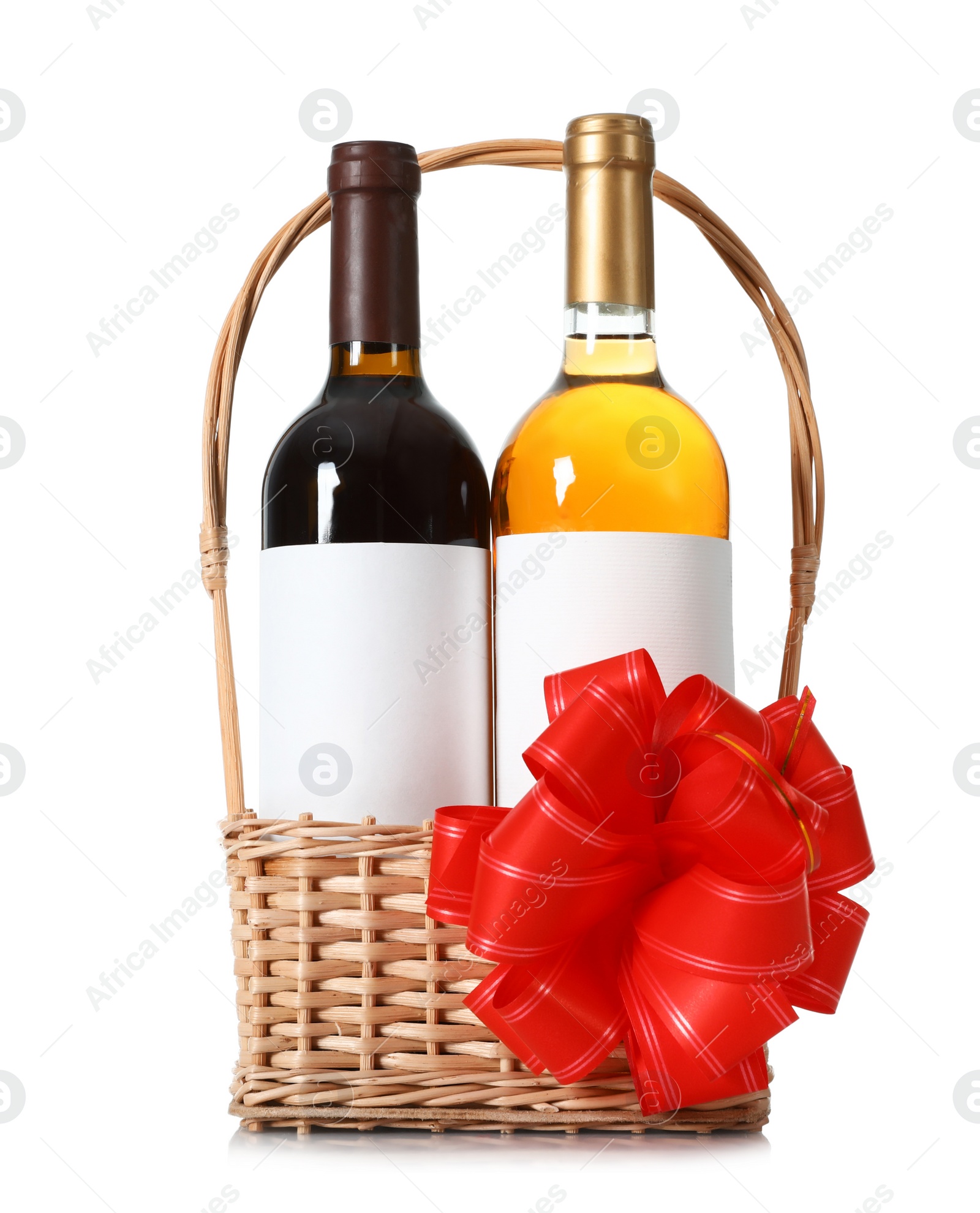 Photo of Festive basket with bottles of wine on white background