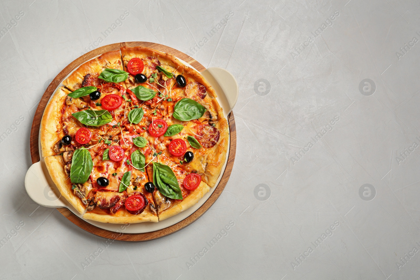 Photo of Tasty homemade pizza and space for text on table, top view