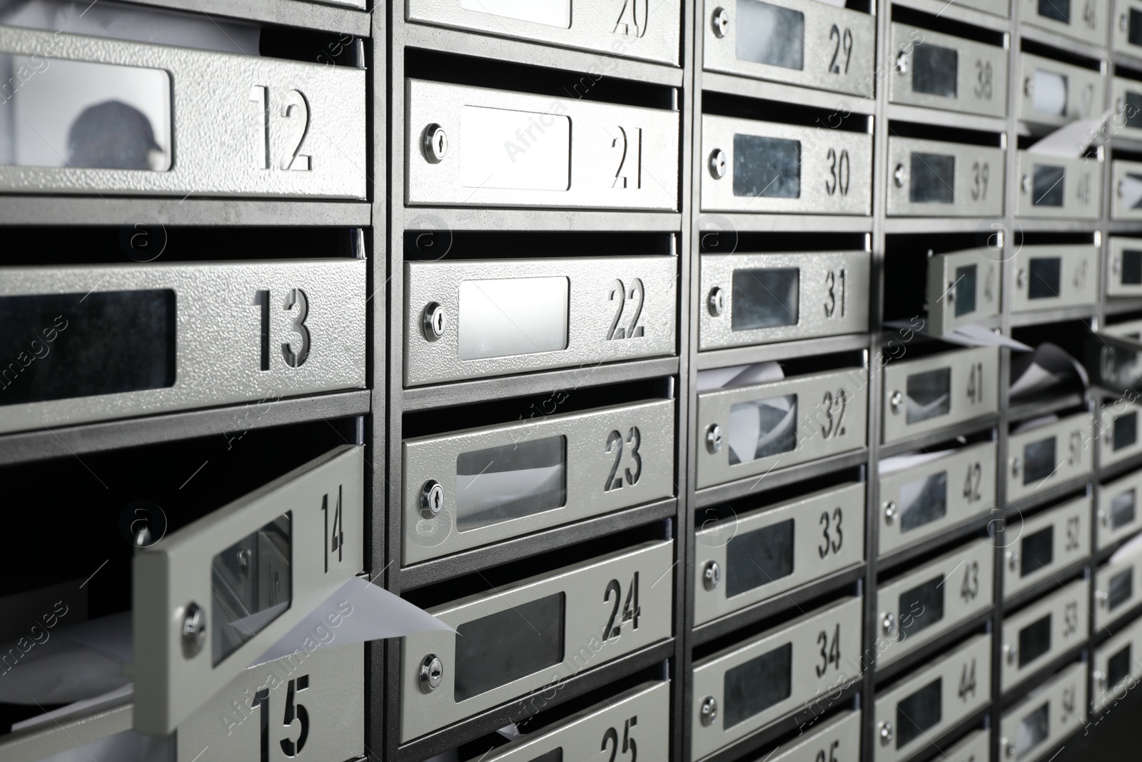 Photo of New mailboxes with keyholes, numbers and receipts