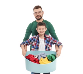 Little boy and his dad with laundry basket on white background