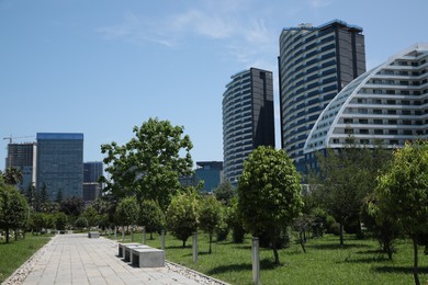 BATUMI, GEORGIA - JUNE 10, 2022: Cityscape with modern buildings and trees