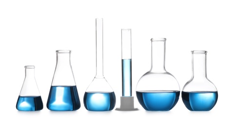 Photo of Set of laboratory glassware with blue liquid isolated on white