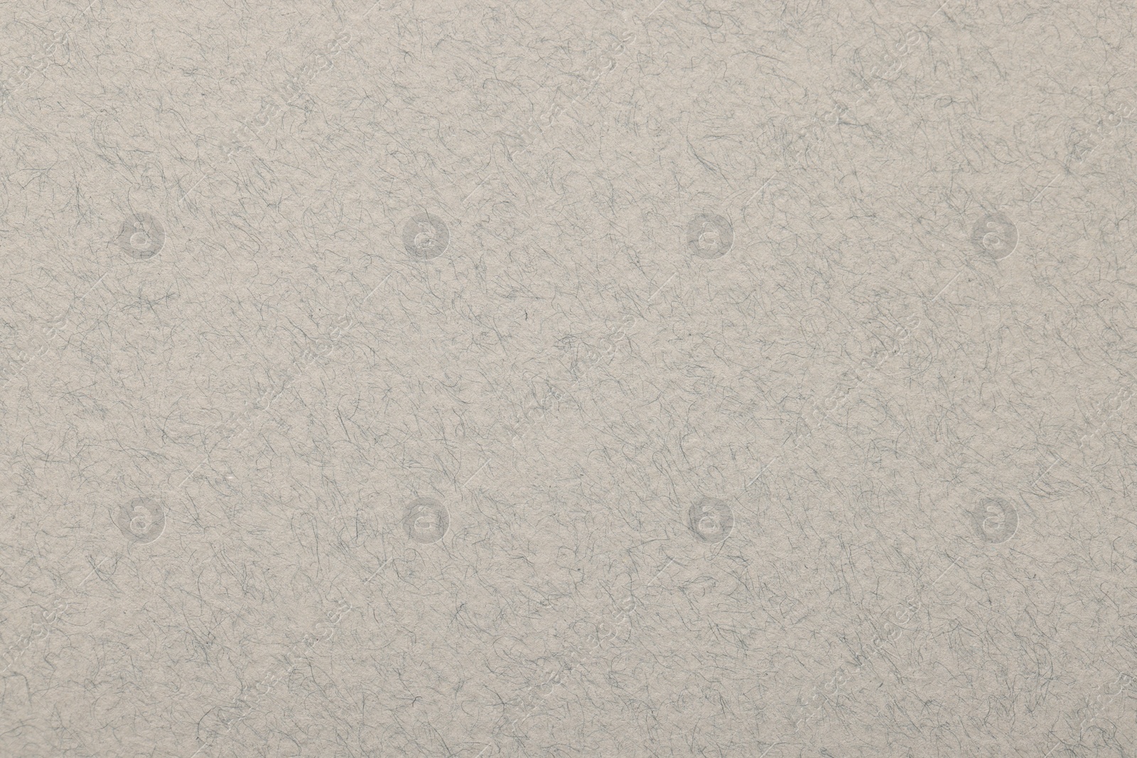 Photo of Texture of light grey paper sheet as background, top view