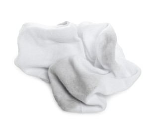 Photo of Pair of dirty socks on white background