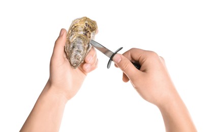 Man opening oyster with knife on white background, closeup