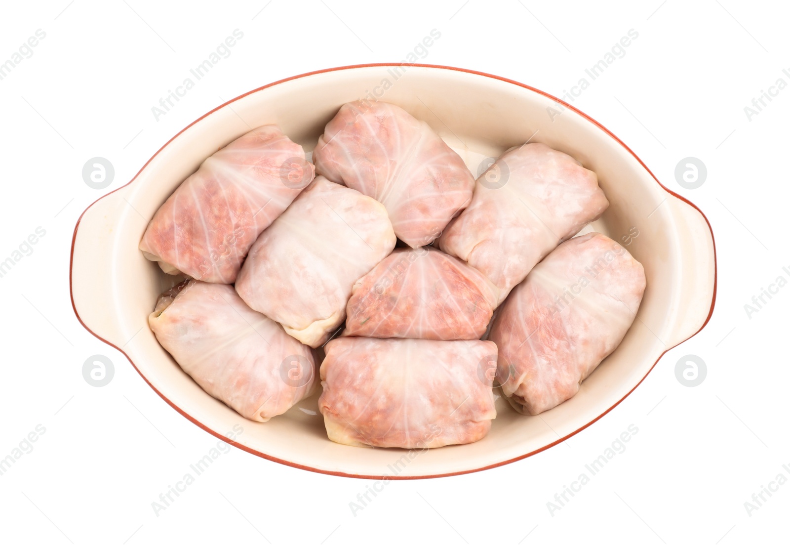 Photo of Stuffed cabbage rolls in baking dish isolated on white, top view