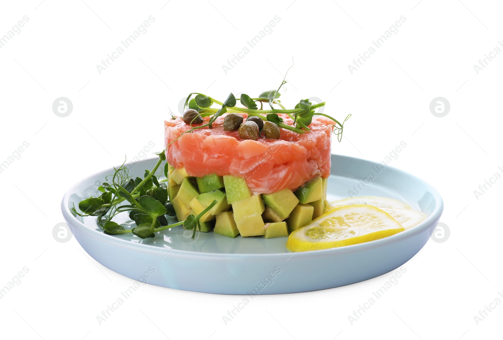 Photo of Tasty salmon tartare with avocado, lemon, capers and microgreens isolated on white