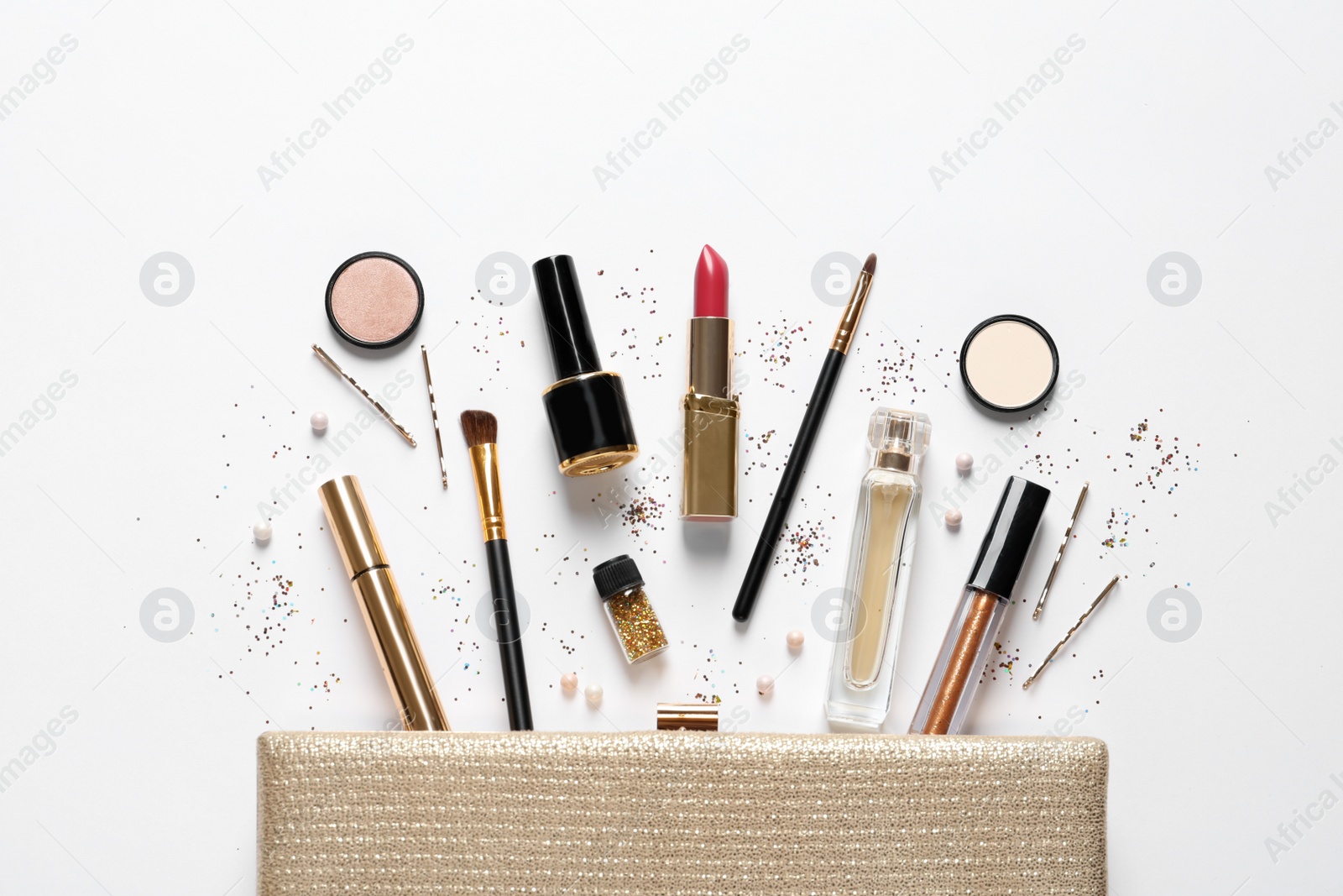 Photo of Cosmetic bag and different luxury makeup products on white background, top view